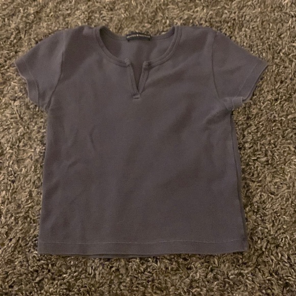 Brandy Melville Tops - Brandy Melville dark blue baby tee. Used with a small rip but no stains.